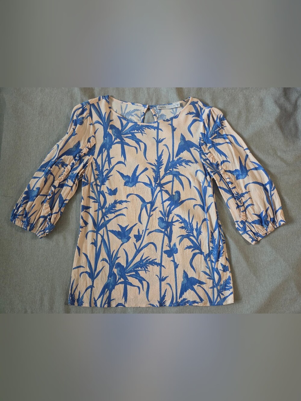 Oasis Blue Botanical Print Blouse on Pale Peach